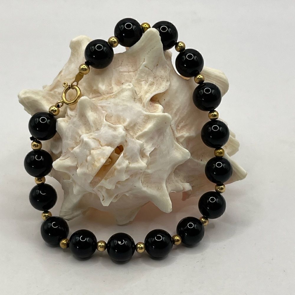 14K gold and Onyx bracelet.